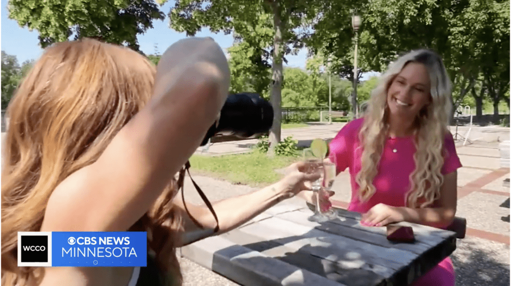 Shannon O'Malley being interviewed on CBS News, discussing confident online dating tips and how professional dating photos empower singles.